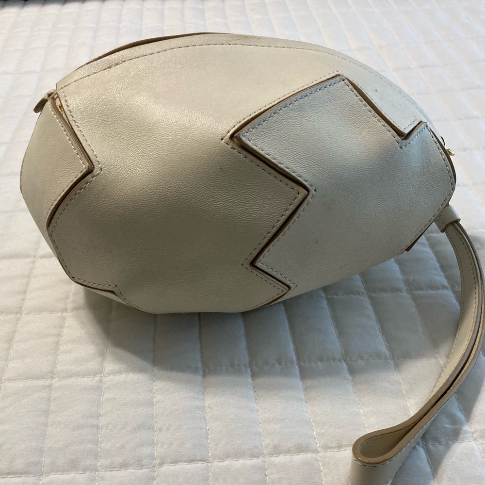 Moschino egg-shaped leather mini bag with a wristlet strap